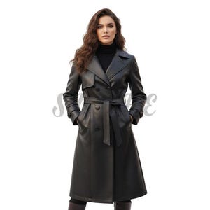 May include: A long, black leather trench coat with a belted waist and double-breasted closure. The coat features a notched collar, shoulder epaulettes, and long sleeves. The model is wearing a black turtleneck.