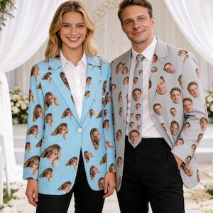 May include: Two people wearing custom-printed blazers. One is light blue with a pattern of a woman's face, the other is gray with a pattern of a man's face. The man is also wearing a matching tie. Both are wearing white shirts and black pants.