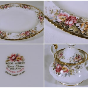 May include: A white oval serving platter with a gold rim and a floral pattern of pink, yellow, and green roses. The platter is made by Royal Albert and is part of the Autumn Roses collection.