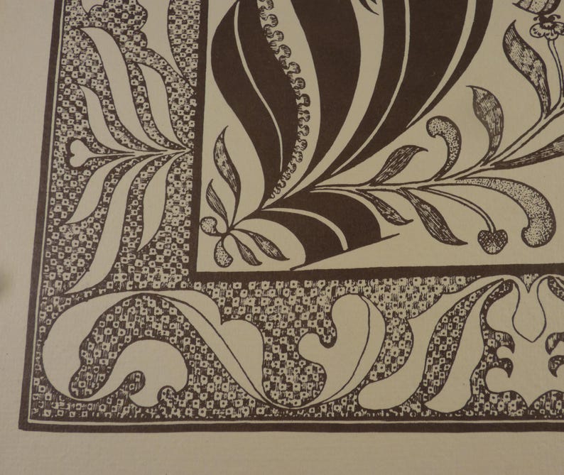 May include: A detailed illustration featuring a brown and cream color palette. The design showcases intricate floral and leaf patterns, with a border of small, square-like shapes. The artwork has a vintage aesthetic, with a focus on decorative elements.