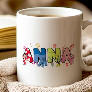 May include: White ceramic mug featuring the name "ANNA" in colorful, cartoon-style letters. Each letter is decorated with a different character from a popular animated series, with floral accents.
