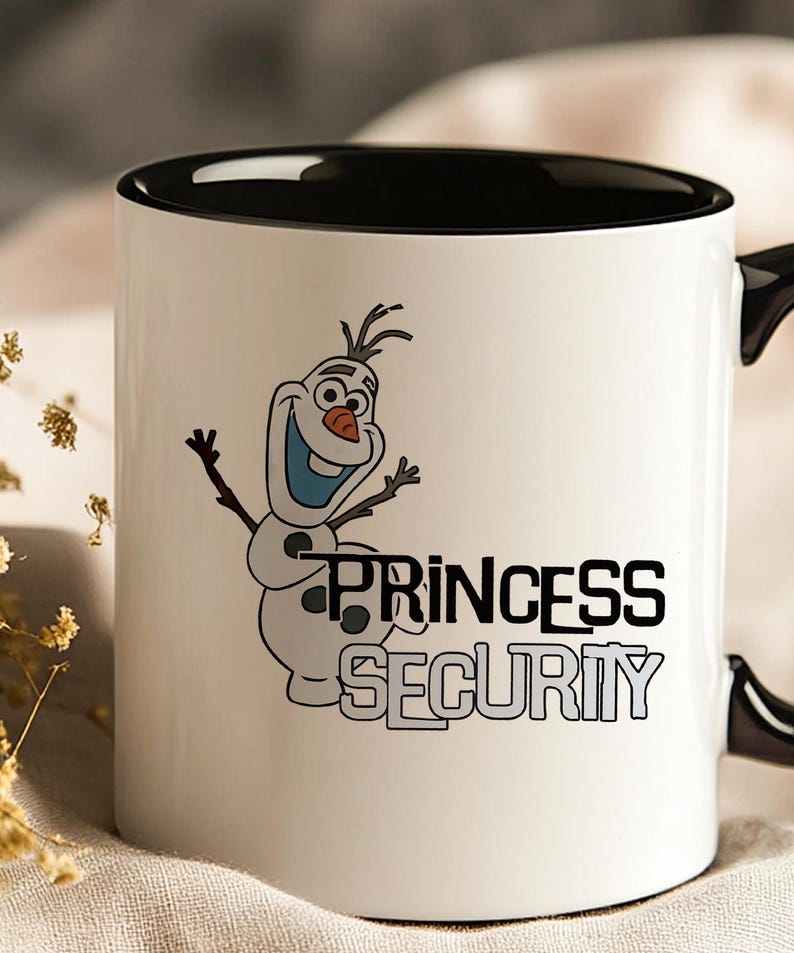 May include: White ceramic mug with a black interior and handle. The mug features a cartoon illustration of Olaf the snowman with the words "PRINCESS SECURITY" in black and gray lettering.