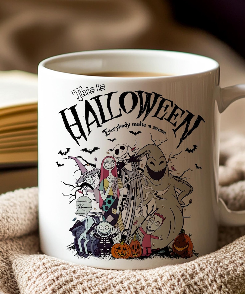 May include: White ceramic mug featuring a Halloween-themed design with characters and the text "This is Halloween." The design includes Jack Skellington, Sally, Oogie Boogie, and other characters from the movie. The mug has a curved handle.