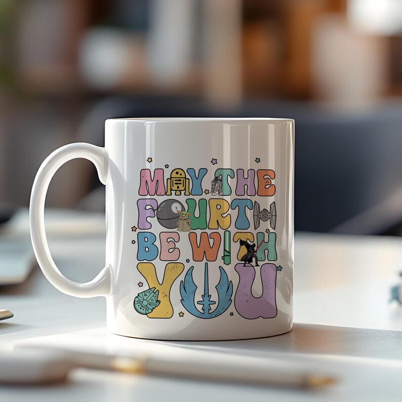 May include: White ceramic mug with a colorful graphic that says "May the Fourth Be With You" and features various Star Wars characters.