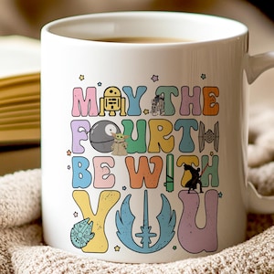 May include: White ceramic coffee mug with a colorful graphic that says "May the Fourth Be With You" and features various Star Wars characters.
