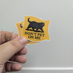 Don’t Pet On Me – Unhinged Void Cat Sticker for Personal Space Patriots