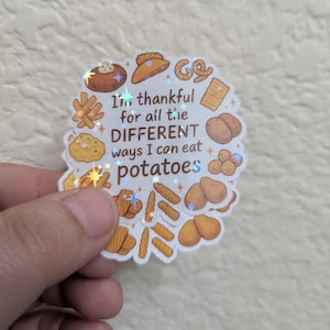 May include: A holographic sticker featuring various potato dishes like fries and mashed potatoes. The sticker has the text "I'm thankful for all the DIFFERENT ways I can eat potatoes."