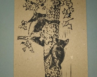 Three block print cards of bears climbing a tree