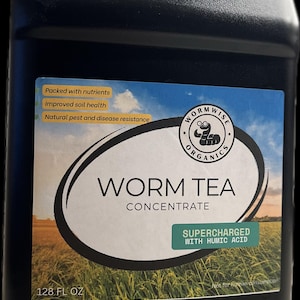 May include: A black plastic gallon jug of Worm Wise Organics Worm Tea Concentrate, supercharged with humic acid. The label features a cartoon worm and the text "Worm Tea Concentrate" and "Supercharged with Humic Acid". The jug is 128 fluid ounces.