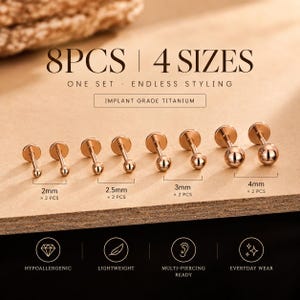 May include: A set of 8 rose gold-coloured ball stud earrings made of implant grade titanium. The set includes 4 sizes: 2mm, 2.5mm, 3mm, and 4mm, with 2 pieces per size. Text on the image reads 8PCS | 4 SIZES, ONE SET · ENDLESS STYLING, IMPLANT GRADE TITANIUM, HYPOALLERGENIC, LIGHTWEIGHT, MULTI-PIERCING READY, and EVERYDAY WEAR.