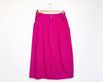 Jupe-Culotte vintage plissée et boutonnée devant. Rose poudré. Taille S