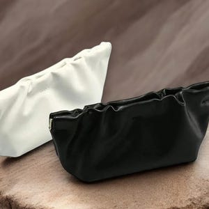 Estuche de cuero para gafas de sol, estuche portátil de cuero sintético, estuche de cuero metálico, estuche de cierre automático, bolso tipo nube para gafas de sol.