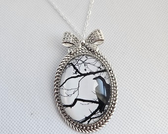 Raven Silhouette-30x40mm black and white raven glass cabochon necklace.