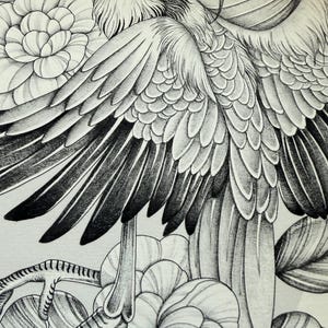 May include: Detailed black and white illustration of a bird with large, textured wings and intricate feather details. The bird is surrounded by stylized flowers and leaves, creating a nature-themed artwork. The drawing style is highly detailed.