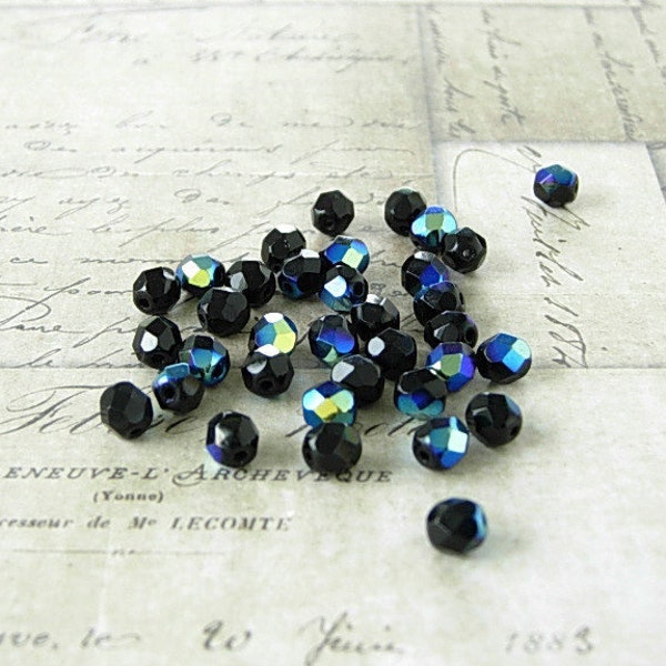 Black AB Czech glass beads. Sparkling, round and faceted, 6 mm loose beads. 35 beads.