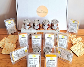 May include: A white box with the text "Roseckin Treats" on the front. The box contains a variety of cheese and chutney flavours, including "Chorizo Espaniol", "Mumbai Spice", "Smoky Oak", and "Black Pepper & Truffle".