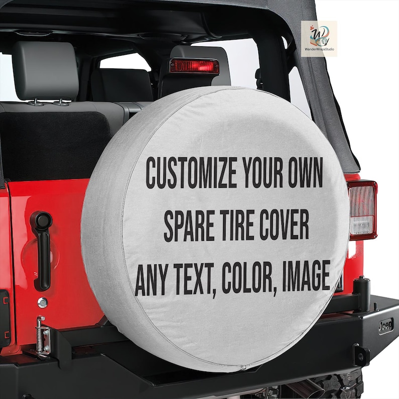 May include: A white spare tire cover with the text "CUSTOMIZE YOUR OWN SPARE TIRE COVER ANY TEXT, COLOR, IMAGE" in black. The cover is mounted on a red Jeep.