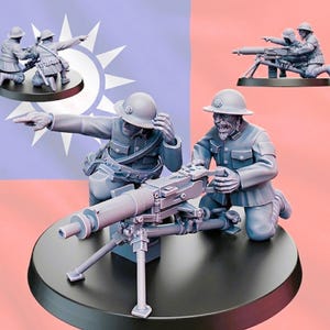May include: Miniature figurines of soldiers operating a machine gun, set against a backdrop of a flag. The figures are detailed in gray, with one pointing and another operating the gun. Additional figures are in the background.