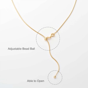 May include: A gold chain necklace with an adjustable bead ball. The bead ball can be opened and closed to adjust the length of the necklace.