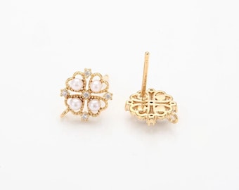 May include: Gold-toned stud earrings featuring a four-leaf clover design. Each clover is adorned with four faux pearls and small, clear crystals. The earrings have a post backing for secure wear.