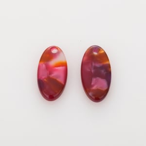 May include: Two oval-shaped pendants with a hole at the top. The pendants have a marbled appearance with shades of red, orange, and white. The pendants are set against a white background.