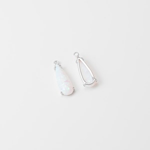 May include: Two teardrop-shaped pendants featuring a white, iridescent stone set in a silver-toned metal frame. Each pendant has a small circular loop at the top for attachment, showcasing a smooth, polished finish and a subtle, shimmering texture.