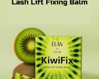 May include: A green box of ELAN KiwiFix Lash Lift Fixing Balm with a kiwi fruit slice. The box has the text "KiwiFix" and "LASH LIFT FIXING BALM". The product is 0.35 oz.