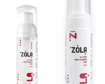 May include: Two white bottles of Zola All In One Brow Cleansing Foam. The bottles have a clear cap and a pump dispenser. The text "Zola" is in a bold, stylized font. The smaller bottle contains 80 ml of foam, and the larger bottle contains 150 ml.