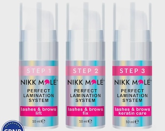 May include: Three clear plastic bottles with white tops and silver labels. Each bottle has a pink banner with the words "STEP 1", "STEP 2", and "STEP 3". The bottles are labeled "NIKK MOLE PERFECT LAMINATION SYSTEM" and "lashes & brows". Each bottle contains 10 ml.