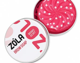 May include: A round, silver tin of ZOLA brow soap. The lid features the brand name and product information. Inside, a pink soap with a star pattern is visible. The open tin displays the soap's spiral design, with white star accents.