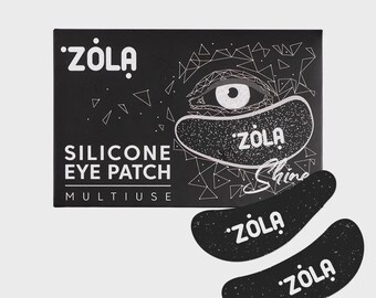 May include: Black silicone eye patches with the brand name "ZOLA" in white. The packaging features the text "SILICONE EYE PATCH" and "MULTIUSE". The design includes an eye illustration and the word "Shine".