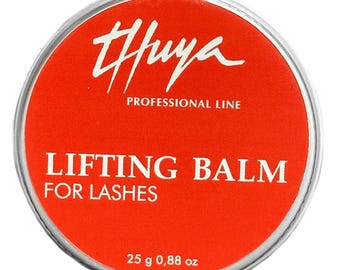 May include: A round, silver-rimmed container with a bright red label. The label features the white text "THUYA PROFESSIONAL LINE" and "LIFTING BALM FOR LASHES." The container holds 25 g or 0.88 oz of product.