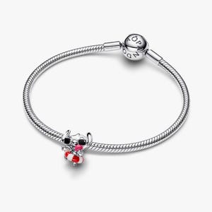 May include: A silver charm bracelet with a charm featuring a cartoon character wearing sunglasses and holding a red and white striped life preserver. The charm is detailed with black, red, and white enamel.