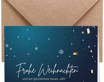 Könnte beinhalten: Eine Weihnachtskarte mit blauem Hintergrund, weißen Schneeflocken und goldenem Konfetti. Auf der Karte steht "Frohe Weihnachten" und "und ein glückliches neues Jahr" in weißer Schrift. Ein brauner Umschlag befindet sich hinter der Karte.