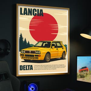 May include: A framed poster depicting a yellow Lancia Delta rally car with a red sun design. The poster includes the text "LANCIA" and "DELTA", and a description of the car's features and history.