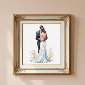 May include: A framed watercolour print showing a couple embracing, the bride in a white and blue gown, the groom in a dark suit. The artwork is surrounded by a gold and white ornate frame, with floral accents at the bottom. The overall theme is romance and weddings.