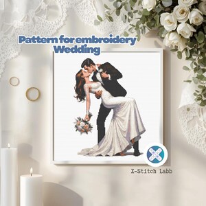 May include: A framed cross-stitch pattern featuring a couple in a romantic embrace, the bride in a white wedding dress and the groom in a black tuxedo. The text "Pattern for embroidery Wedding" is at the top.