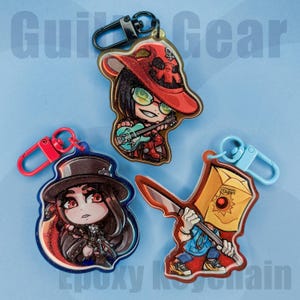 Guilty Gear Strive | Glittrig Epoxi Nyckelring | Jag-Nej, Testamentet, Faust