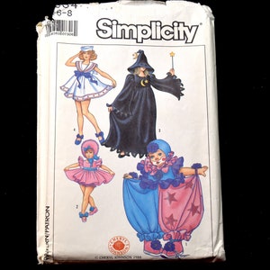 May include: Simplicity sewing pattern for children's costumes. The pattern includes three costumes: a sailor, a witch, and a clown. The pattern is for sizes 6-8.