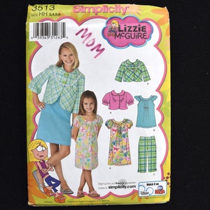 May include: Simplicity sewing pattern 3513 for a mom and child outfit. The pattern includes a plaid jacket, a pink blouse, a floral dress, and a plaid skirt. The pattern is from the Lizzie McGuire collection.