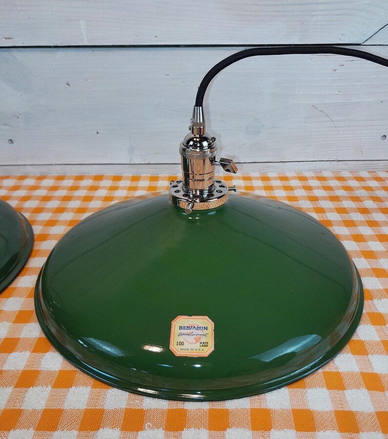 May include: A white ceramic mug with a black handle and the text "But First, Coffee" in a black, handwritten-style font. The mug is on a white surface.