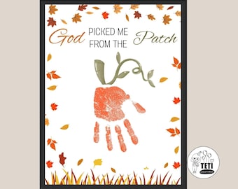 May include: A framed print with the text "God Picked Me From The Patch." The artwork features a handprint transformed into a pumpkin, with green vines and autumn leaves scattered around. The print is set against a white background.