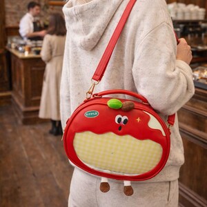 Medium Polyurethane Apple-Shaped Backpack Crossbody Bag with Pin Display Amazon.com: VVRPWASSLY Cute Apple Ita Bag Badges Pins  main image 4