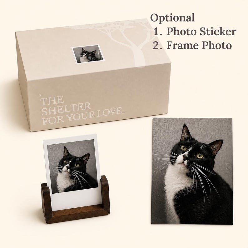 May include: A beige rectangular box with the text THE SHELTER FOR YOUR LOVE, featuring a small cat photo sticker. Includes a square photo of a black and white cat in a dark wood stand and a rectangular portrait of the same cat on a flat surface.
