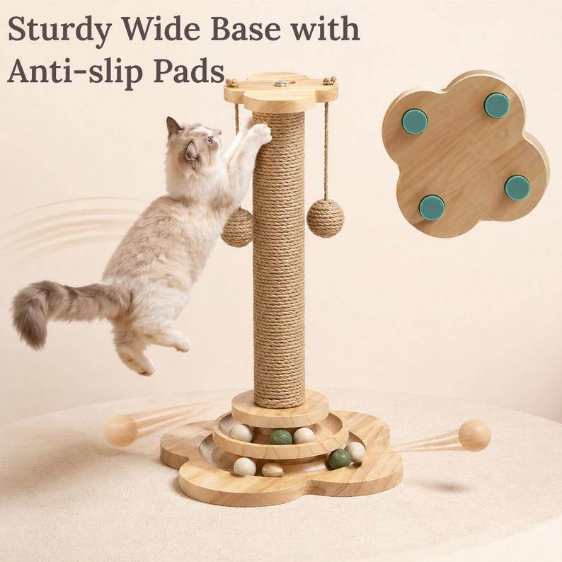 May include: A light-colored wooden cat scratching post with a flower-shaped base, a central sisal-wrapped column, two hanging rope balls, and a circular track containing small wooden balls. The text reads Sturdy Wide Base with Anti-slip Pads.