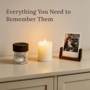 Pet memorial set components including ceramic urn, LED candle, glass fur jar with wooden lid, and small wood acrylic photo frame.
