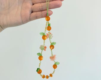Breloque pour téléphone ornée de perles : dragonne florale avec perles de cristal