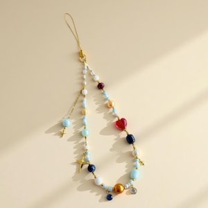 Ciondolo per cellulare con perline celestiali: cinturino con stella e cuore in cristallo color oro blu