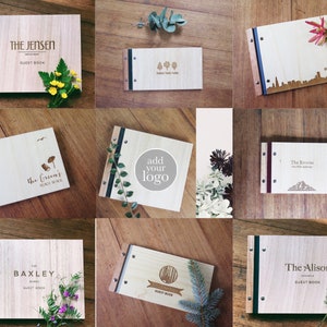 Nine different images of timber guest books are arranged in a grid pattern. Each image contains a book that has been engraved with a unique logo or image.