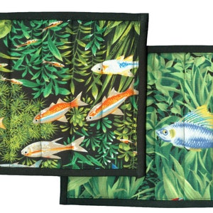 May include: Two black framed pot holders with a green and black background featuring colorful fish and plants.